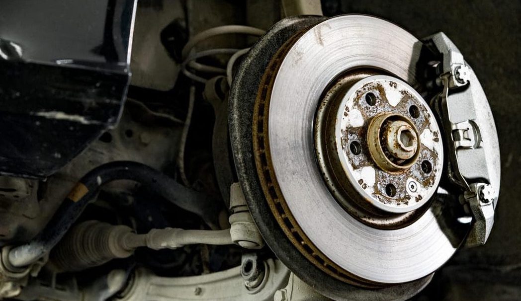 steel brake disc with pad in car service 2023 11 27 05 15 18 utc1